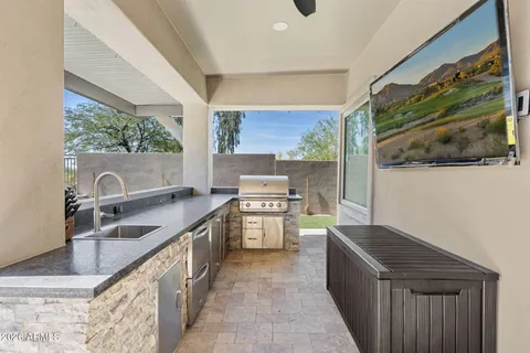 a view of a house with swimming pool and sitting area
