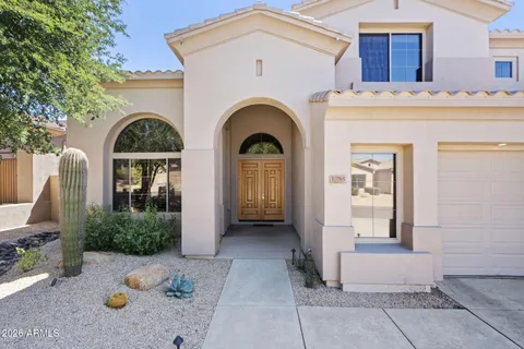 a living room with furniture a chandelier and a chandelier