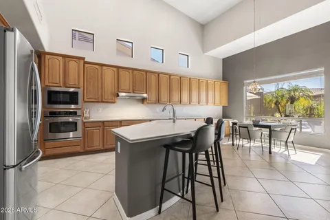 a kitchen with a table and chairs in it