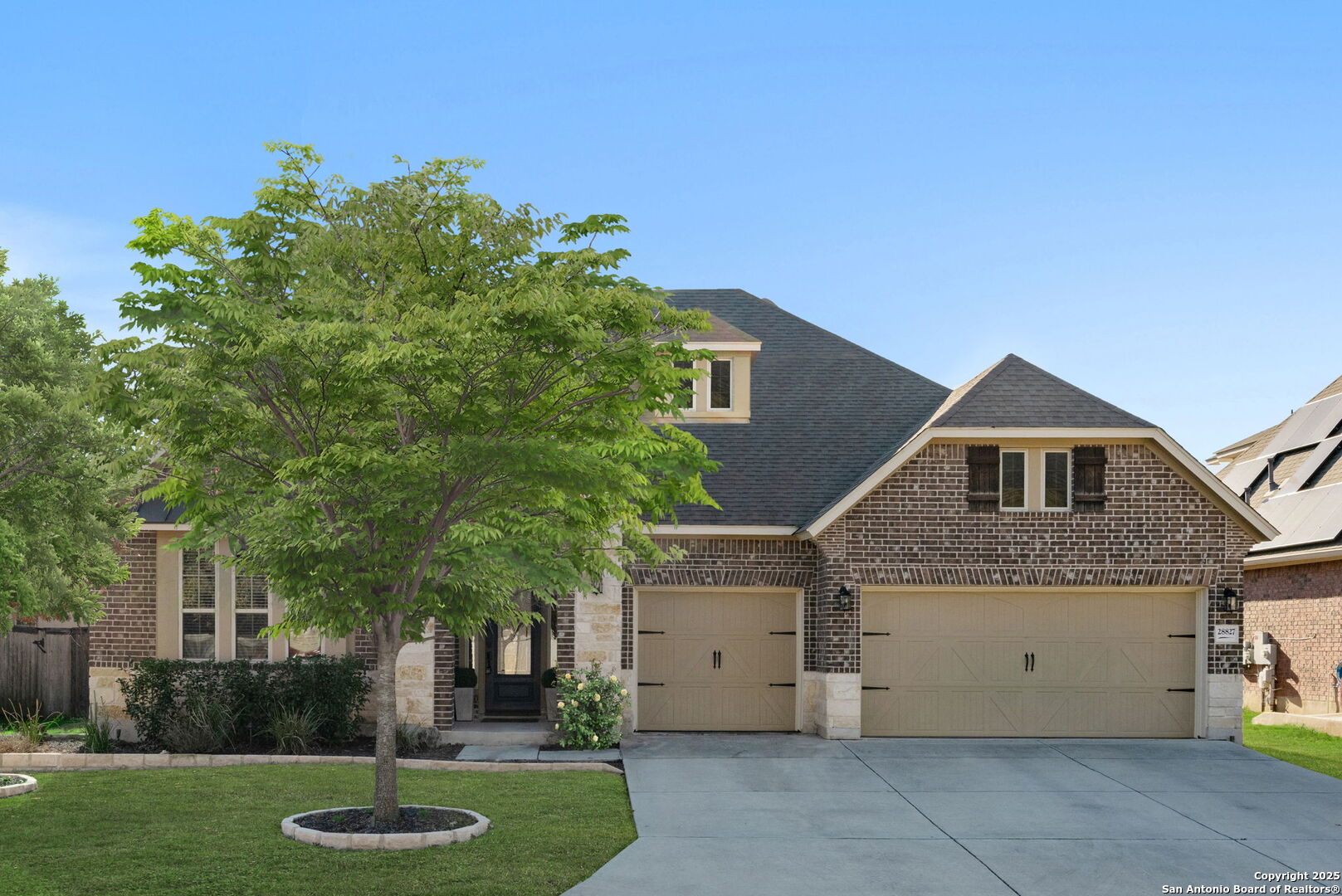 28827 Pfeiffers Gate Fair Oaks Ranch, TX 78015 - Photo 32 of 36 a front view of a house with a garden