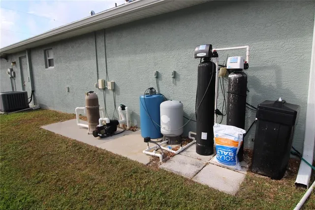 a view of a workspace with furniture and gym equipment