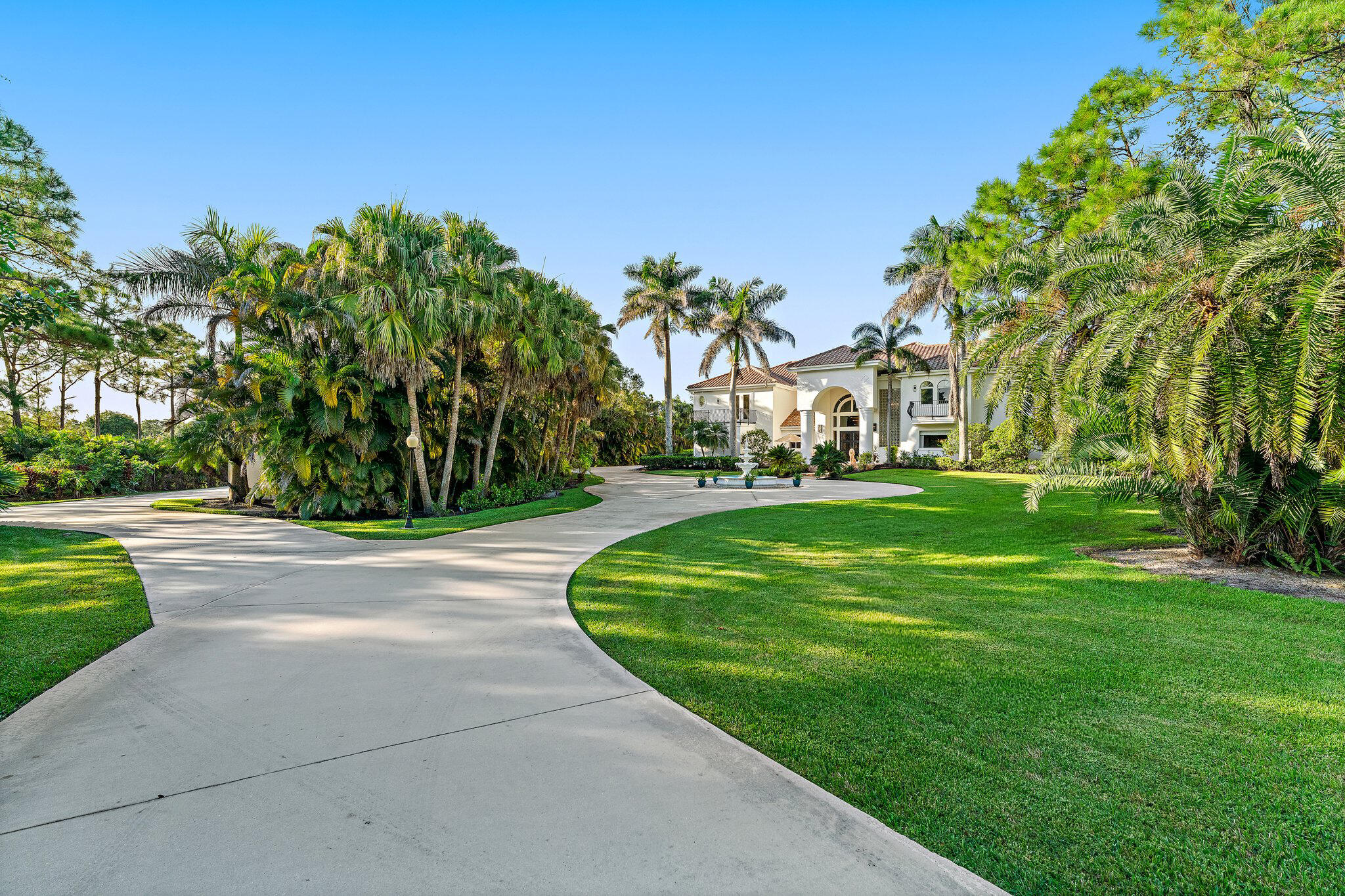 2584 Southeast Ranch Acres Circle Jupiter, FL 33478 - Photo 82 of 83 Private Driveway Arrival