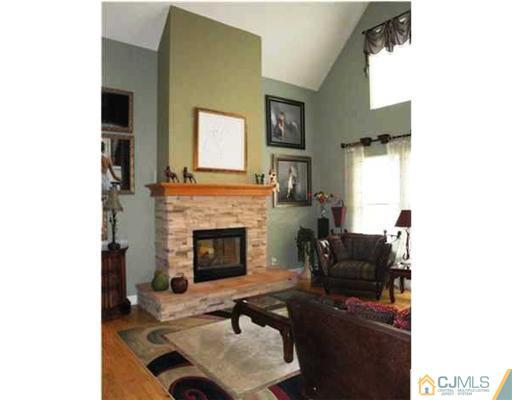 150 Emley's Hill Road Cream Ridge, NJ 08514 - Photo 5 of 11 a living room with furniture and a fireplace