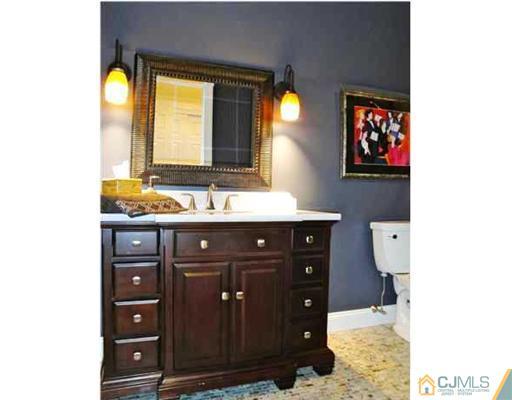 150 Emley's Hill Road Cream Ridge, NJ 08514 - Photo 8 of 11 a bathroom with a sink and a mirror