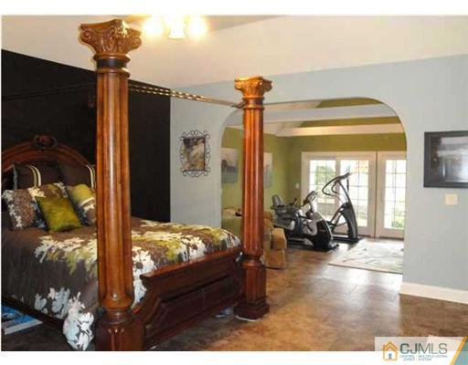 150 Emley's Hill Road Cream Ridge, NJ 08514 - Photo 10 of 11 a bedroom with furniture and large windows