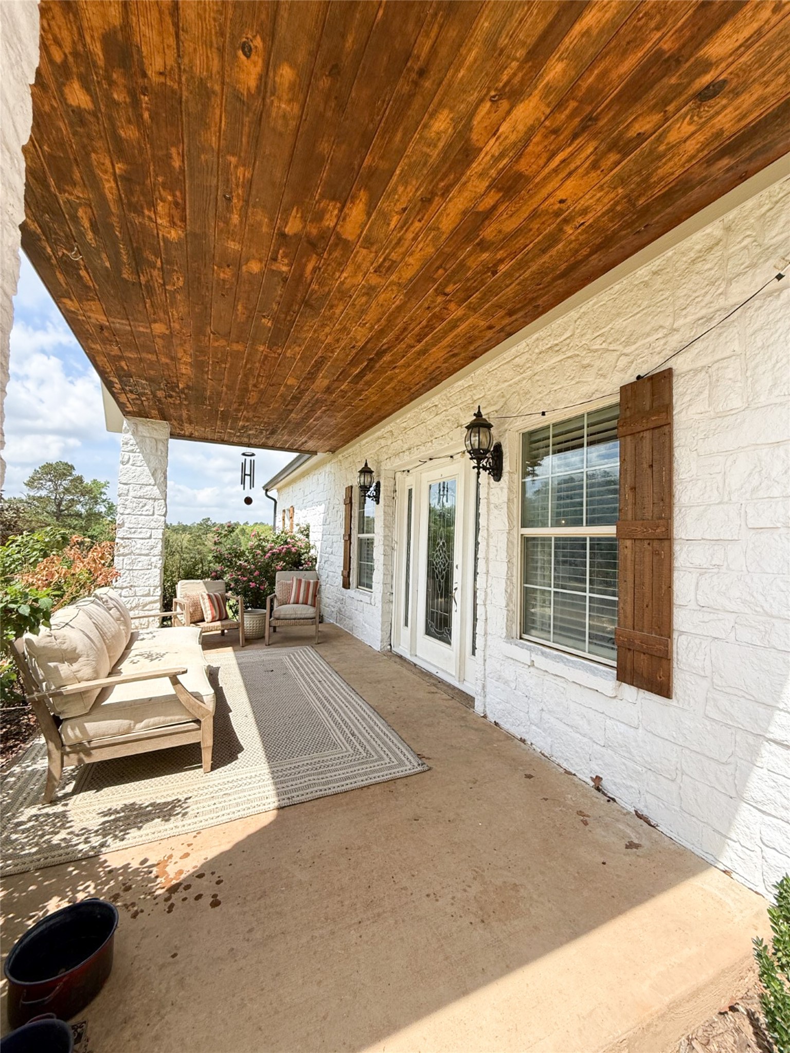 740 Bridget Avenue Buffalo, TX 75831 - Photo 9 of 50 a view of a patio with table and chairs and potted plants