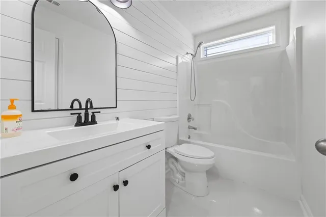 a view of a storage & utility room with two washing machine