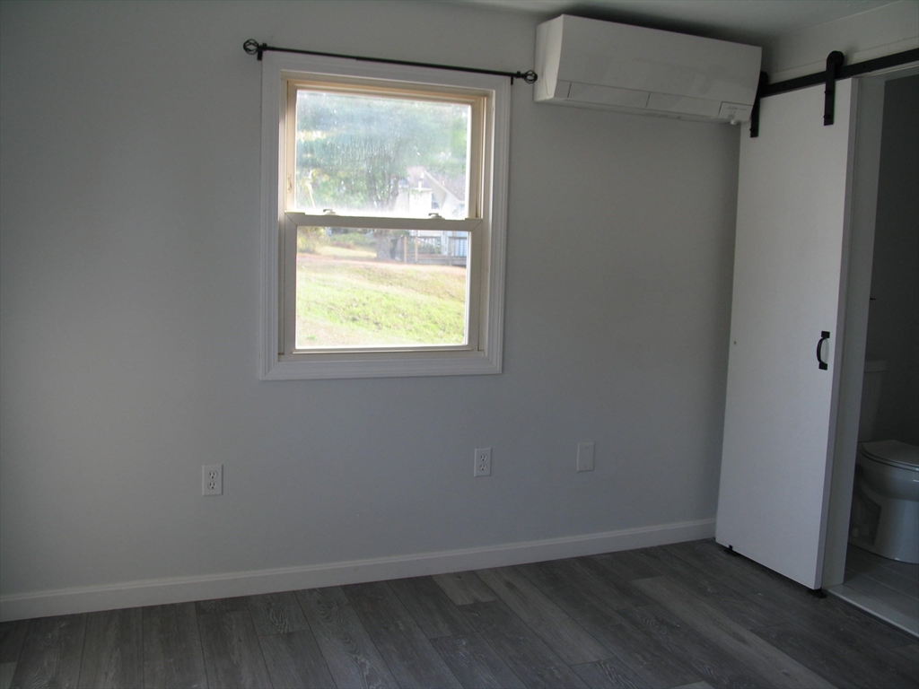 11 Black Point Road Webster, MA 01570 - Photo 15 of 28 a view of an empty room with wooden floor and a window