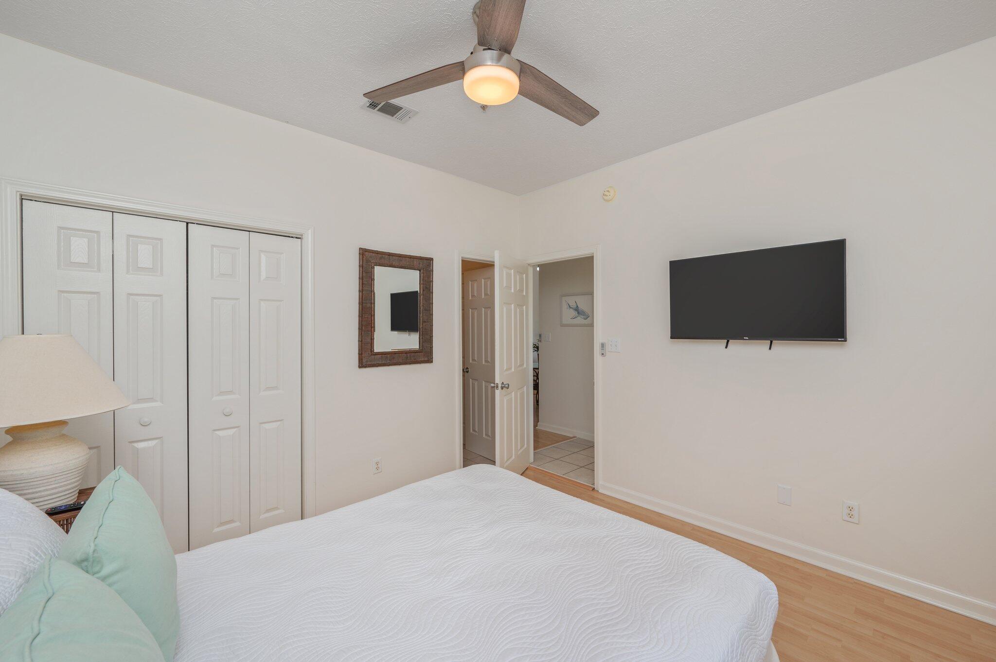 34 Heron's Watch Way, Unit 2303 Santa Rosa Beach, FL 32459 - Photo 24 of 45 a bedroom with a bed and a flat tv screen on the dresser
