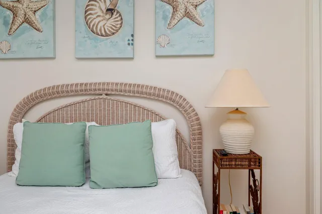 a bedroom with a bed and a mirror