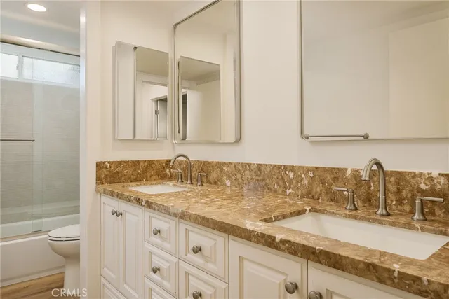 a bathroom with a shower and a toilet