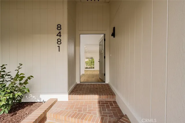 a view of a bedroom from a hallway