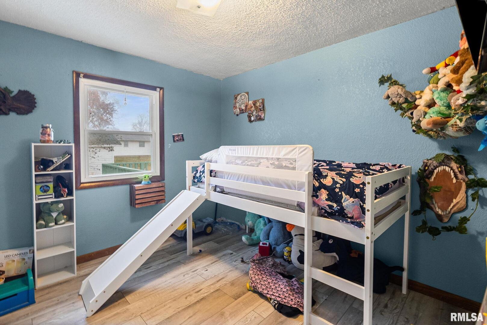 103 Middleton Street Iuka, IL 62849 - Photo 22 of 27 a bed room with a bed and a window
