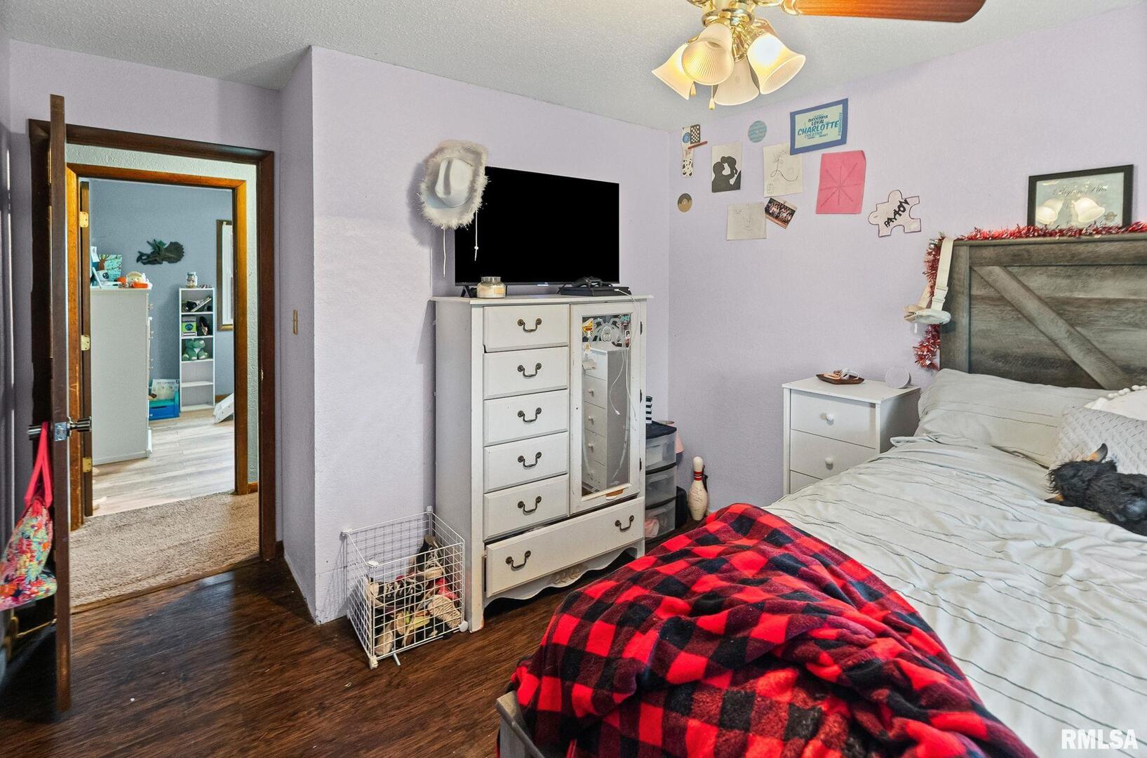 103 Middleton Street Iuka, IL 62849 - Photo 25 of 27 a bedroom with a bed and flat tv screen on dresser