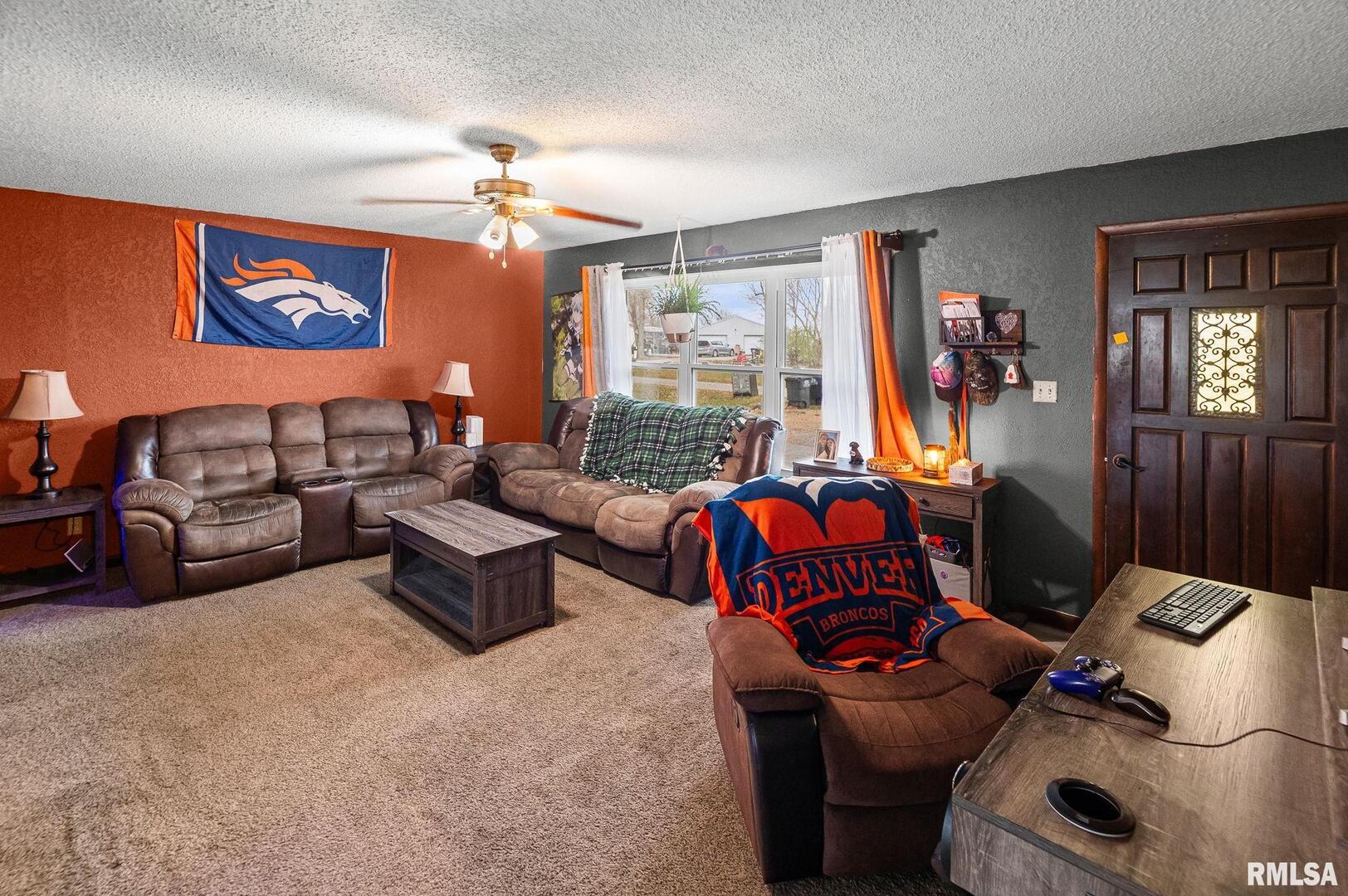 103 Middleton Street Iuka, IL 62849 - Photo 8 of 27 a living room with furniture a chandelier and a window