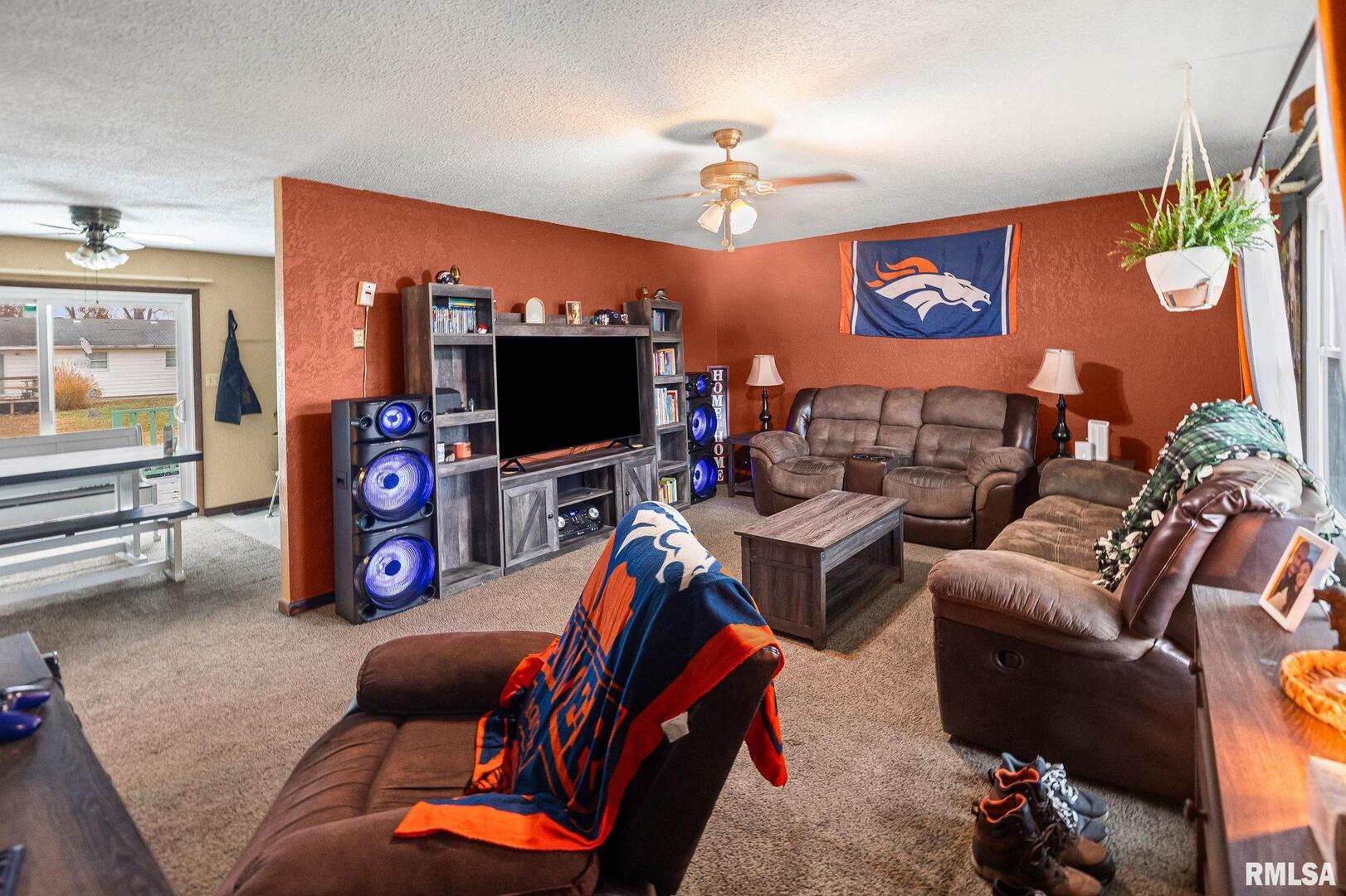 103 Middleton Street Iuka, IL 62849 - Photo 9 of 27 a living room with furniture and a flat screen tv