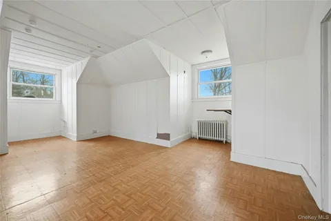 a view of an house with backyard and trees