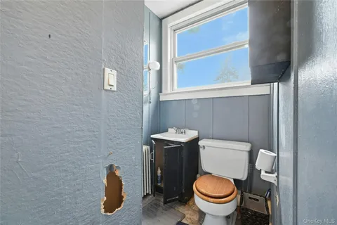 a view of bathroom with a wooden floor and a shower
