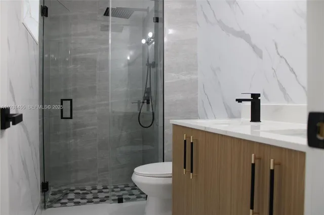 a kitchen with kitchen island a sink stove and wooden cabinets