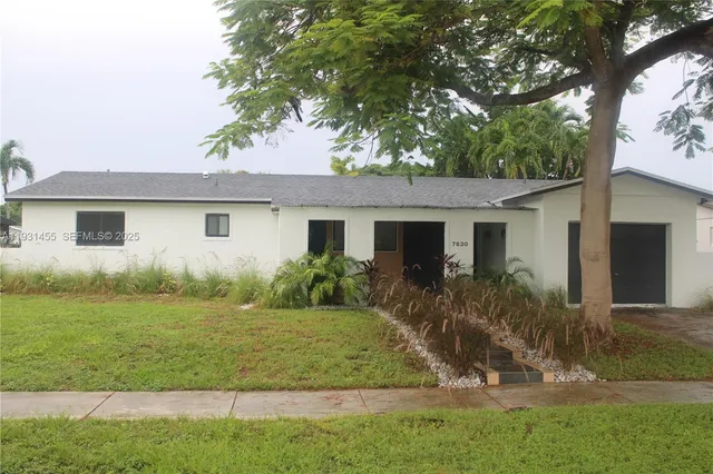a kitchen with stainless steel appliances a refrigerator and a sink