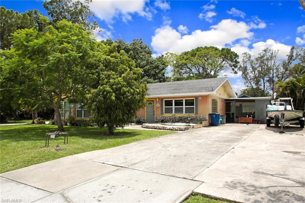 4391 Little Hickory Road Bonita Springs, FL 34134 - Photo 1 of 35 a view of a house with outdoor space and tree s