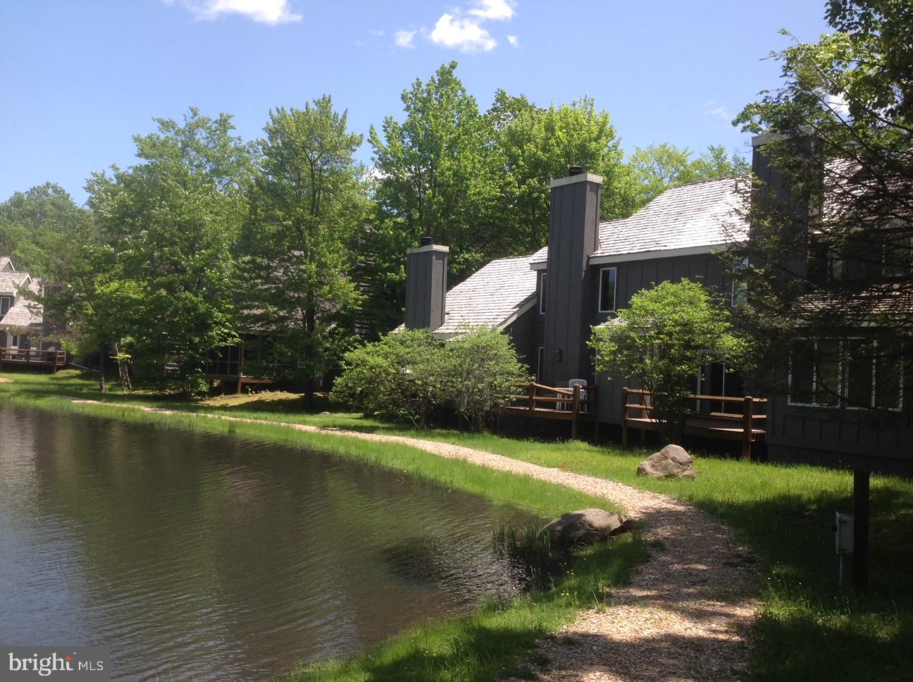 390 Snow Ridge Cir Lake Lake Harmony, PA 18624 - Photo 2 of 60 a view of a lake with a house in the background