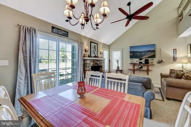 a kitchen with granite countertop kitchen island stainless steel appliances a sink stove top oven and cabinets