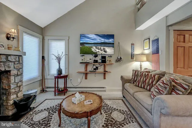 a kitchen with stainless steel appliances granite countertop a stove a sink dishwasher a refrigerator and cabinets with wooden floor