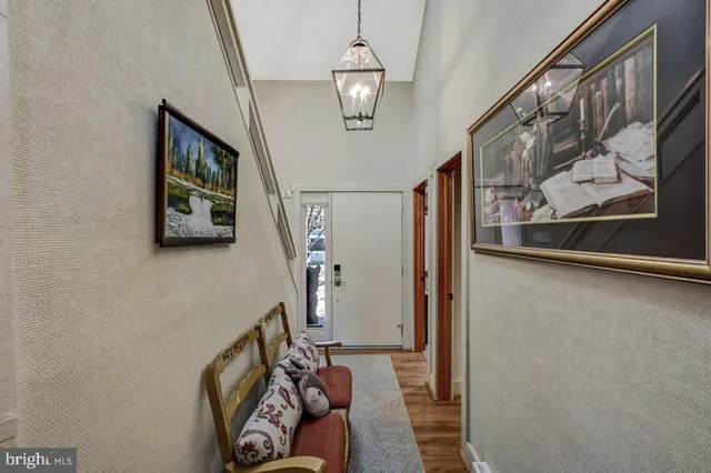 a bedroom with a large bed and a flat screen tv
