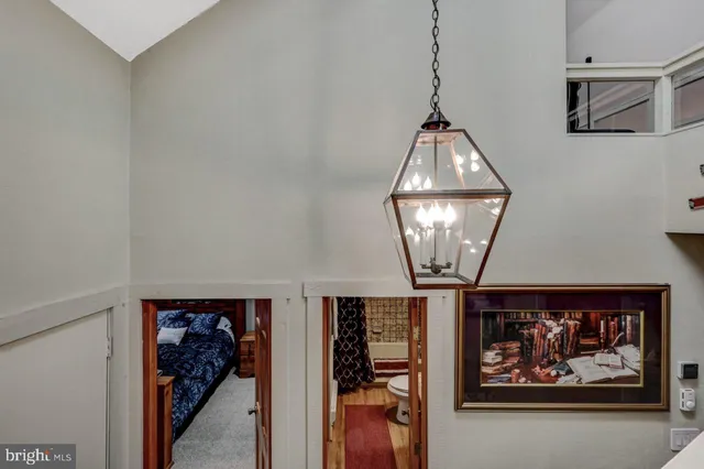 a living room with furniture and a ceiling fan