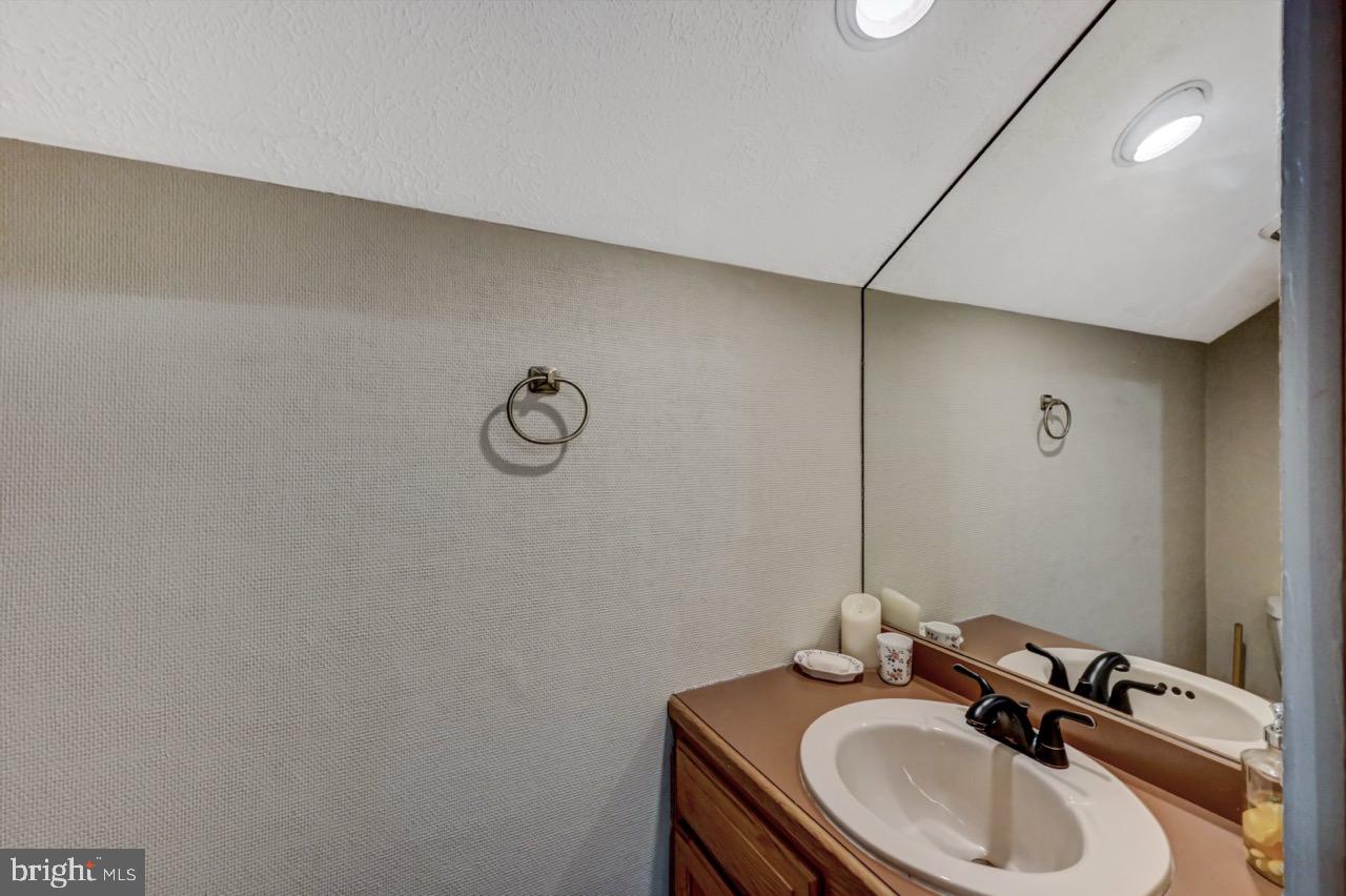 390 Snow Ridge Cir Lake Lake Harmony, PA 18624 - Photo 58 of 60 a bathroom with a sink and a mirror