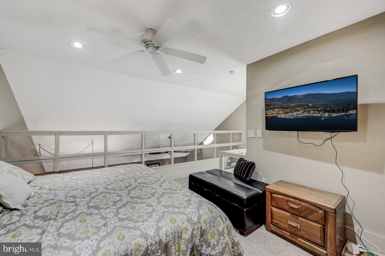 390 Snow Ridge Cir Lake Lake Harmony, PA 18624 - Photo 59 of 60 a bedroom with a bed and a flat screen tv