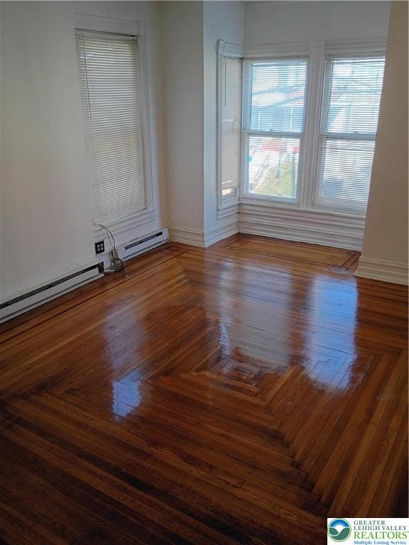 24 North 13th Street Allentown, PA 18102 - Photo 11 of 38 wooden floor in an empty room with a window