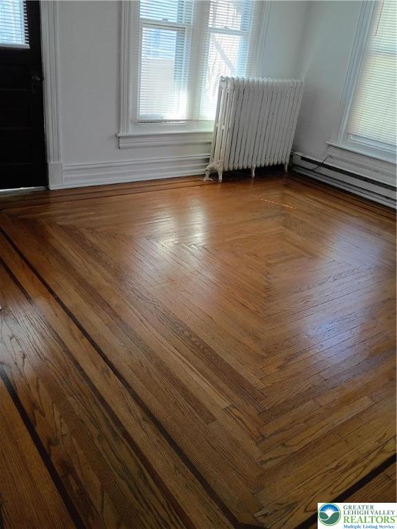 24 North 13th Street Allentown, PA 18102 - Photo 13 of 38 an empty room with wooden floor and windows