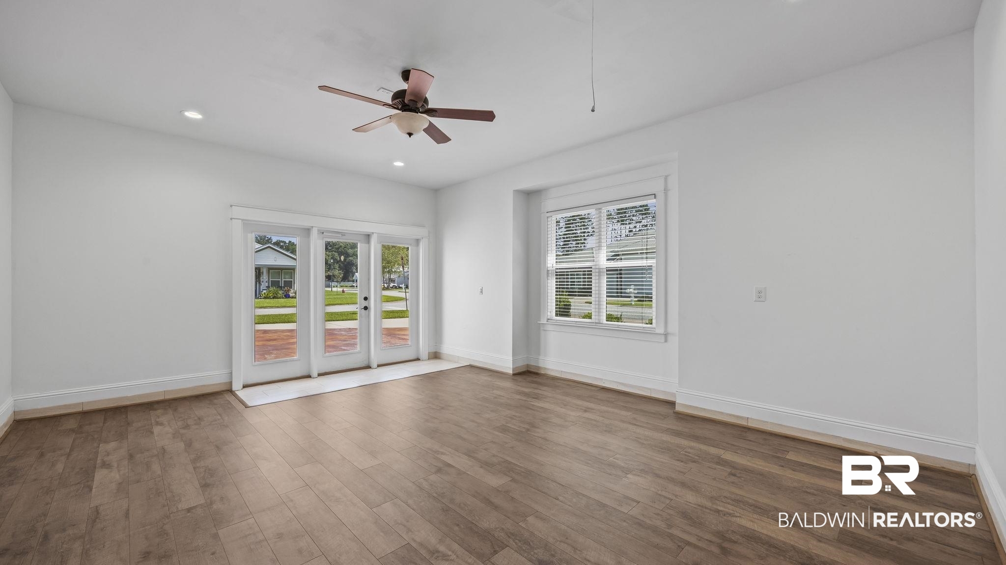 12361 Reunion Place Foley, AL 36535 - Photo 26 of 43 Unfurnished room featuring wood finished floors, a ceiling fan, and recessed lighting