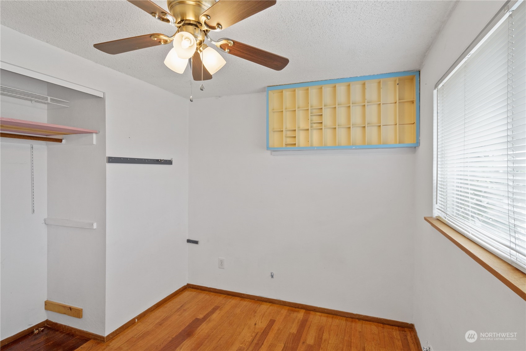 16632 124th Avenue Southeast Renton, WA 98058 - Photo 16 of 29 a view of empty room with wooden floor and fan