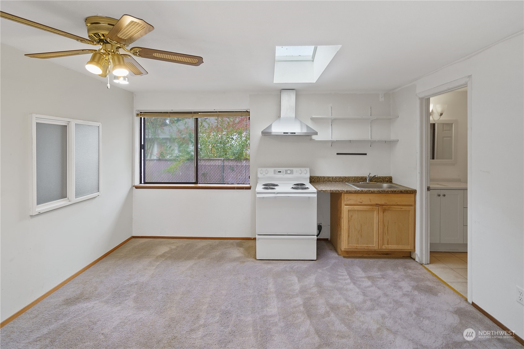 16632 124th Avenue Southeast Renton, WA 98058 - Photo 23 of 29 a kitchen with a stove a sink and a refrigerator