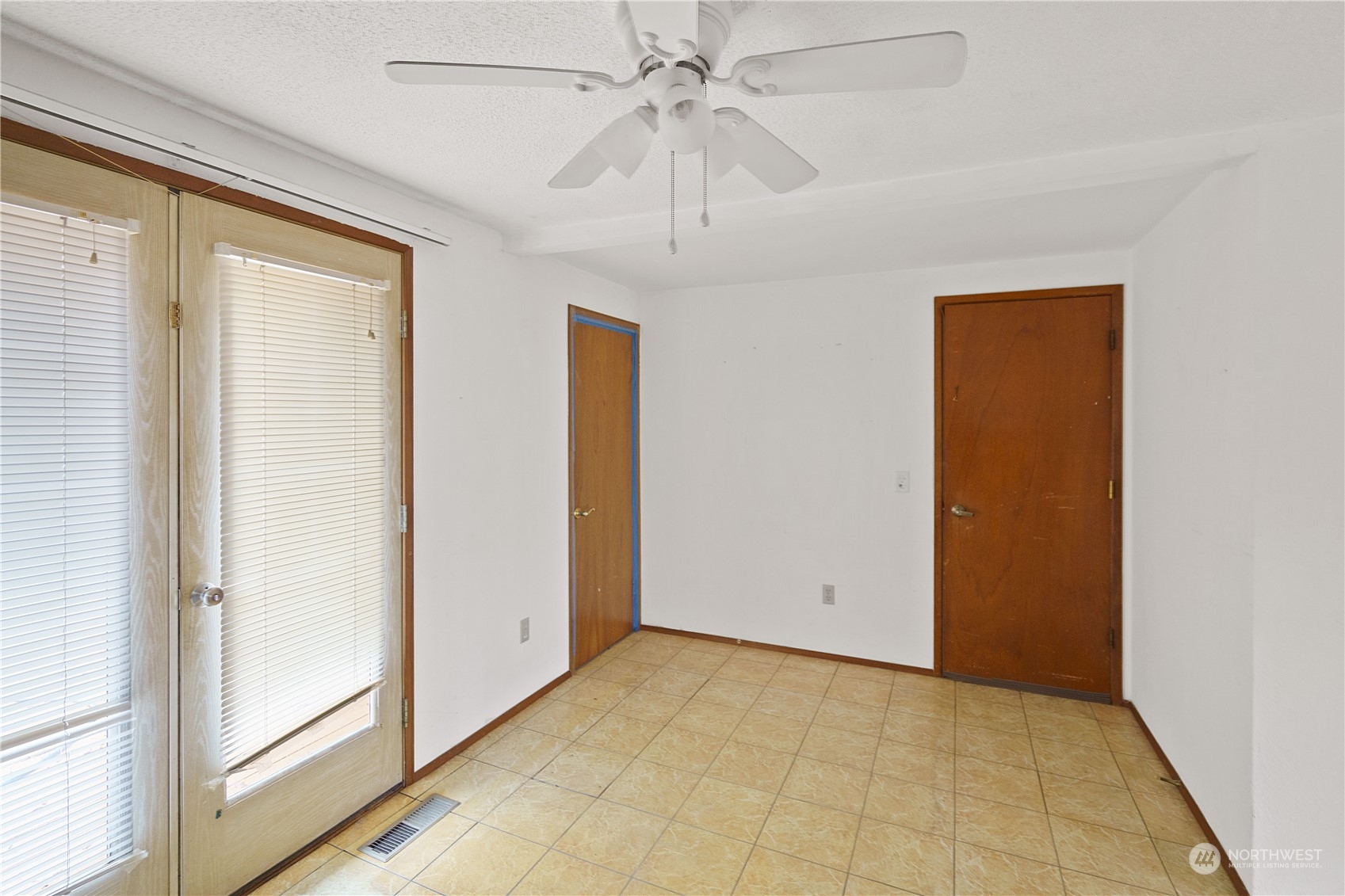16632 124th Avenue Southeast Renton, WA 98058 - Photo 8 of 29 a view of an empty room with a window