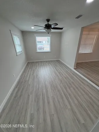 a view of an empty room with a window