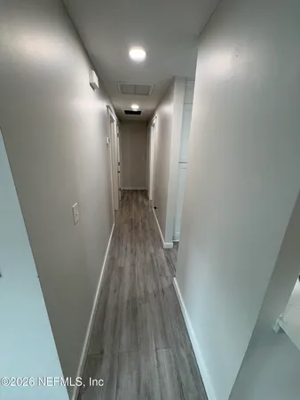 a view of an empty room with a window