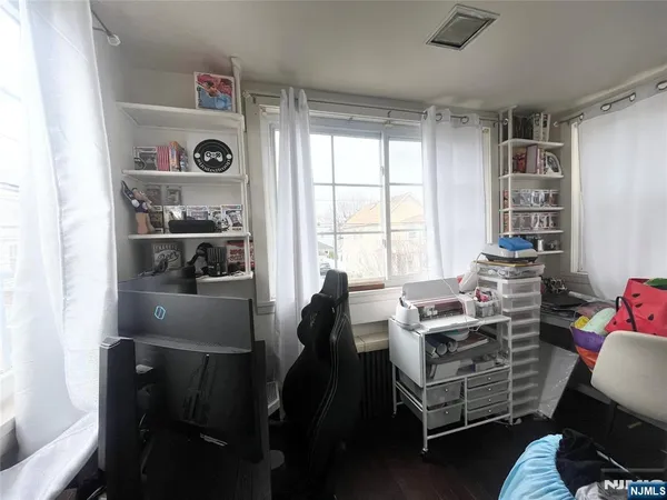 a bedroom with a bed and cabinets