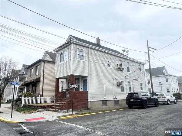 a car parked in front of a house