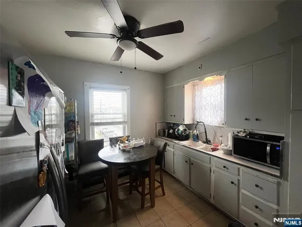 a view of a dining room with furniture and window