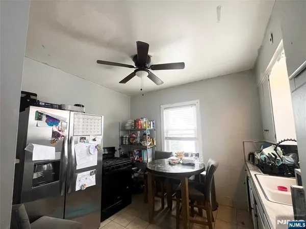 a view of a dining room with furniture and window