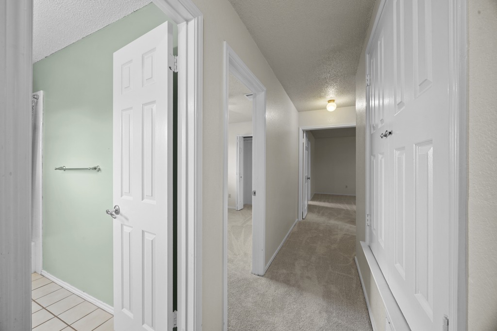 1000 West Noton Street Pflugerville, TX 78660 - Photo 19 of 35 a view of a hallway with wooden floor