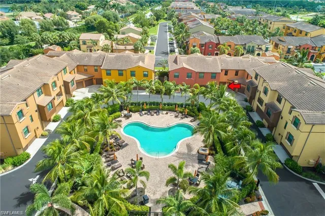 an aerial view of residential houses with outdoor space and street view