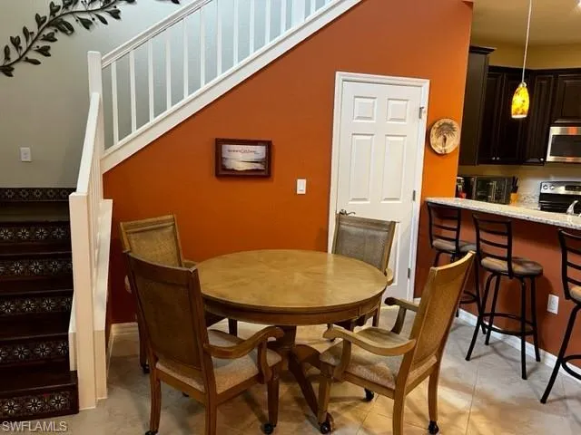 a view of a dining room with furniture and window