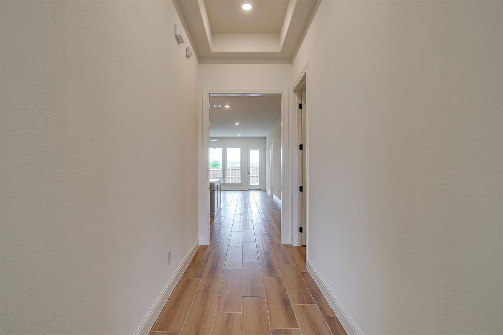 7286 Velvetleaf Street Benbrook, TX 76126 - Photo 12 of 39 a view of gallery with wooden floor