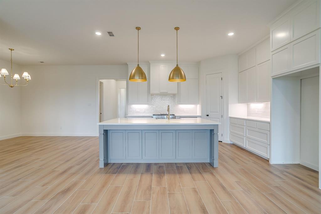 7286 Velvetleaf Street Benbrook, TX 76126 - Photo 20 of 39 a view of kitchen and wooden floor