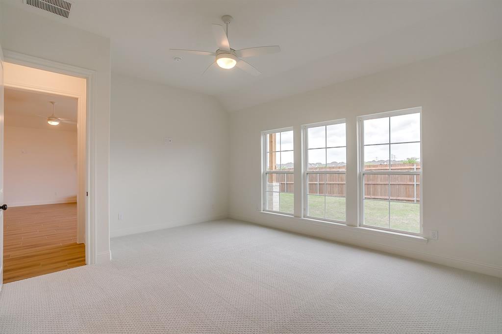 7286 Velvetleaf Street Benbrook, TX 76126 - Photo 27 of 39 an empty room with windows and closet
